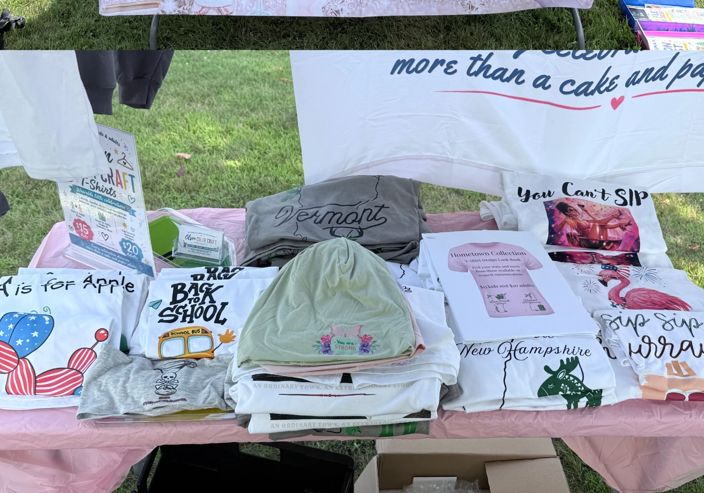 Handmade Olsen Colorcraft apparel and hometown designs displayed at a Vermont craft fair