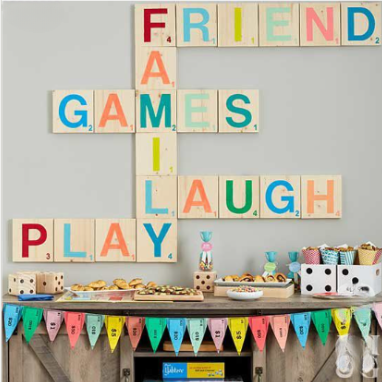 Game night party inspiration — giant scrabble tile wall with dessert table