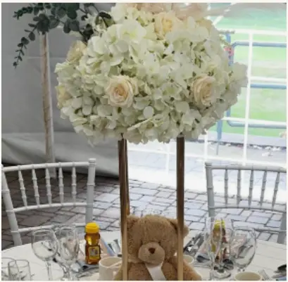 Classic Gold & White Baby Shower inspiration — elegant gold glitter backdrop with florals