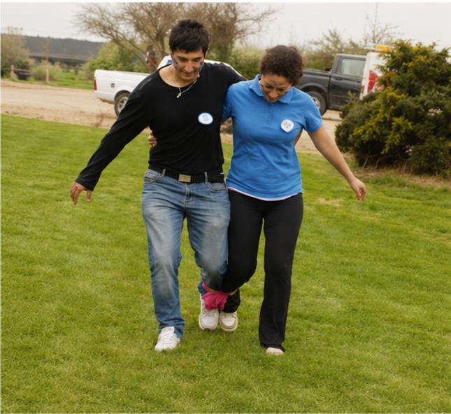 Two players competing in three-legged race at backyard Olympics