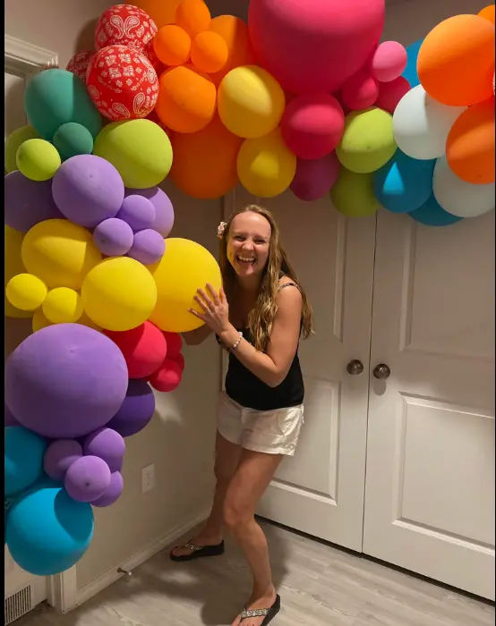 Real Rep Your Color Party — guests dressed in rainbow colors at color party
