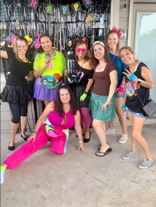 Real decades party — mixed decade costumes at indoor celebration