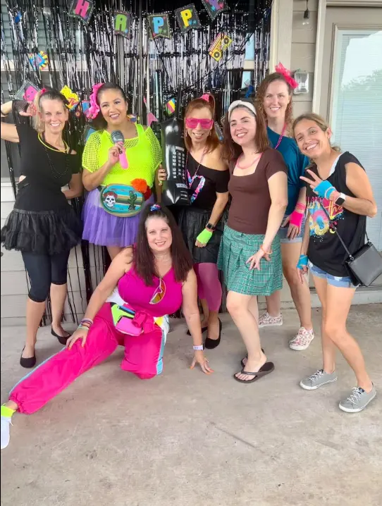 Real decades party — mixed decade costumes at indoor celebration