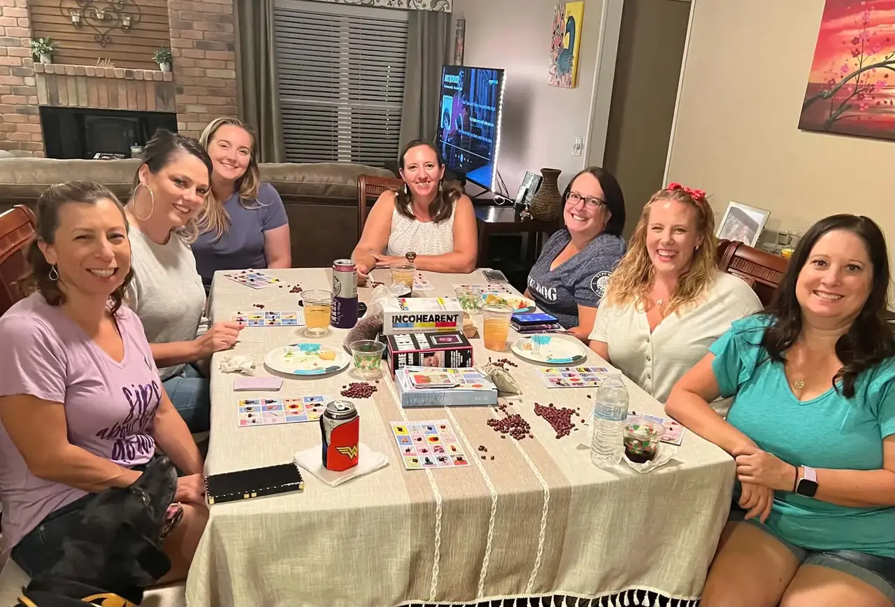 Real game night party — friends enjoying a competitive game night together