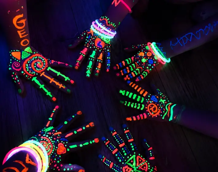 Glow party inspiration — neon hand art glowing under black lights