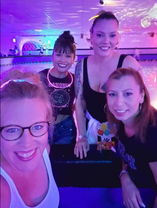 Real glow party — guests in UV-reactive skeleton and neon outfits dancing outdoors