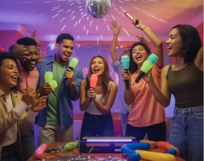 Karaoke party inspiration — group of friends dancing and singing with colorful microphones under disco lights