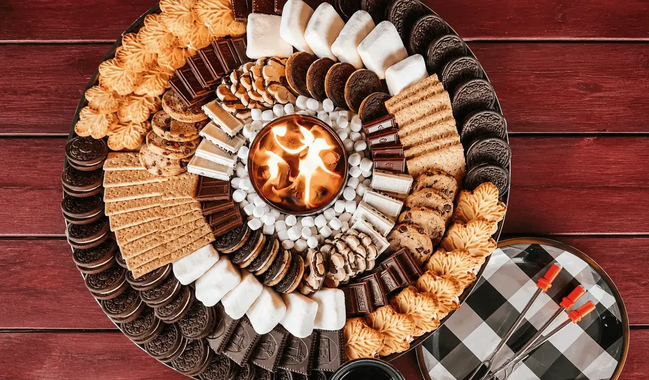 Gourmet s'mores bar with Nutella, strawberries, marshmallows and string lights