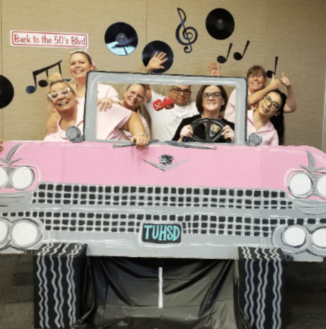 Sock Hop party — three friends in retro TV frame photo prop