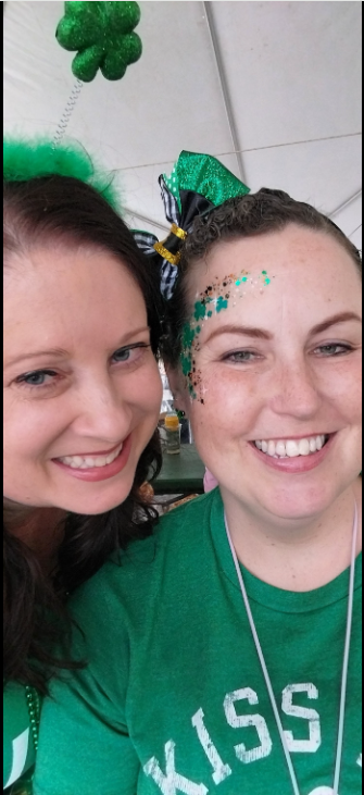 Real St. Patrick's Day celebration — friends at outdoor St. Patrick's Day event in festive green