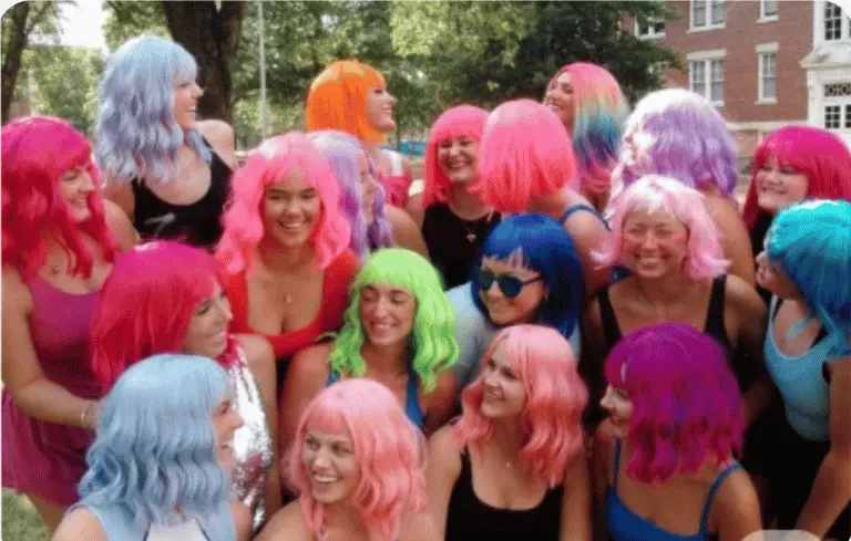 Fun Wig Party inspiration — large group of women in bright colorful wigs outdoors