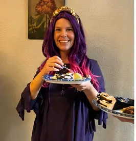 Real wig party — group of women in colorful wigs enjoying cake and food