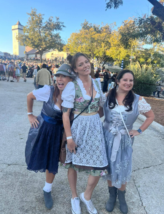 Friends celebrating in traditional Oktoberfest dirndl attire